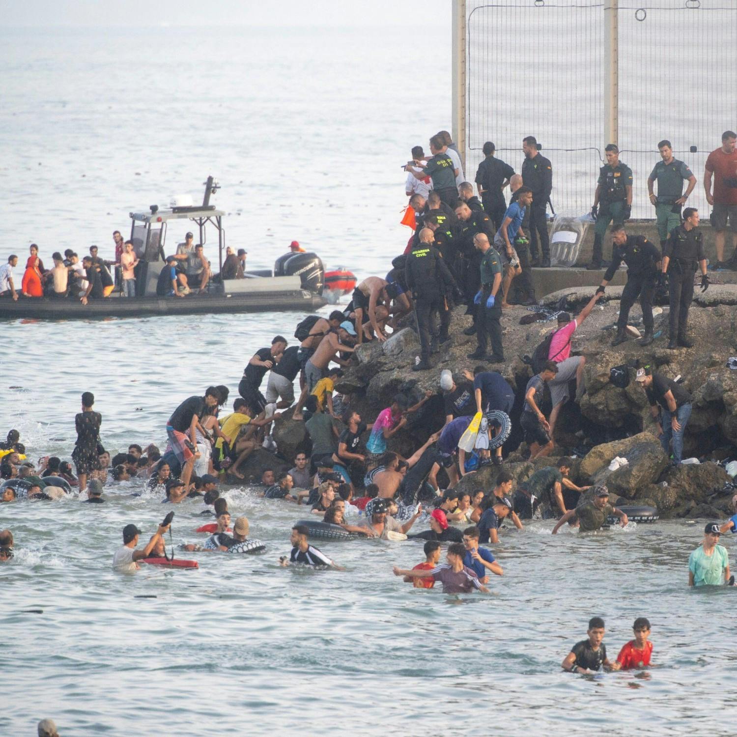 Thousands of migrants enter Spanish enclave from Morocco