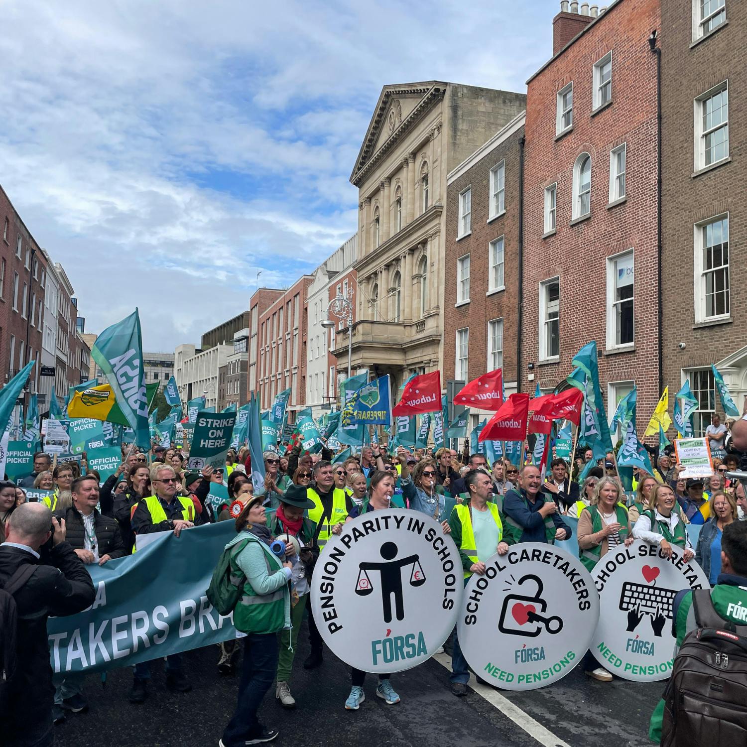 School secretaries and caretakers protest out the Dail today